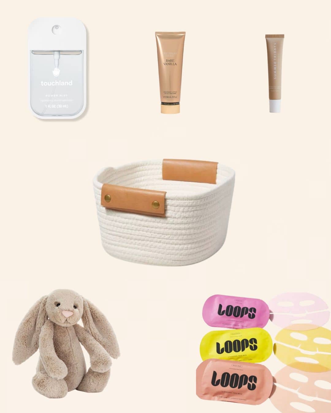 A flat lay image featuring a white woven basket with tan handles in the center, surrounded by hand sanitizer, two tubes of skincare products, a plush beige bunny, and colorful Loops face masks.