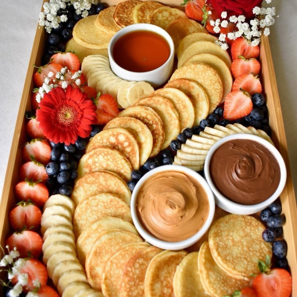 A tray of pancakes and fruit—perfect for your pre-prom brunch. Add this delicious spread to your list of unforgettable pre-prom ideas!.