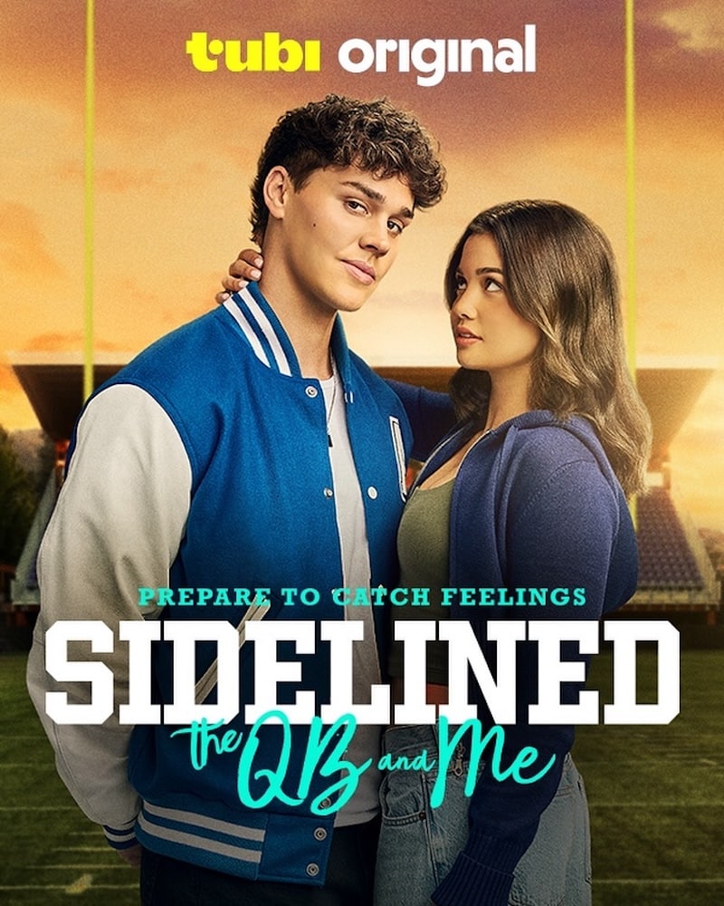 Two teens stand on a football field, the boy in a blue varsity jacket and the girl leaning against him. Text reads: tubi original. Prepare to catch feelings with this rom com—Sidelined: the QB and Me, inspired by the best Wattpad novels.