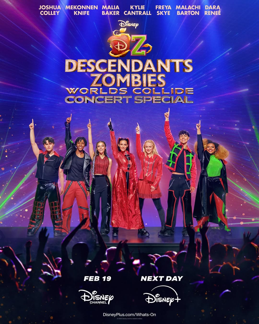 Seven young performers in colorful costumes stand on stage under bright lights, striking energetic poses with one arm raised. The backdrop features logos for Disney’s Descendants, Zombies, and Oz—don’t miss this worlds collide concert special!.