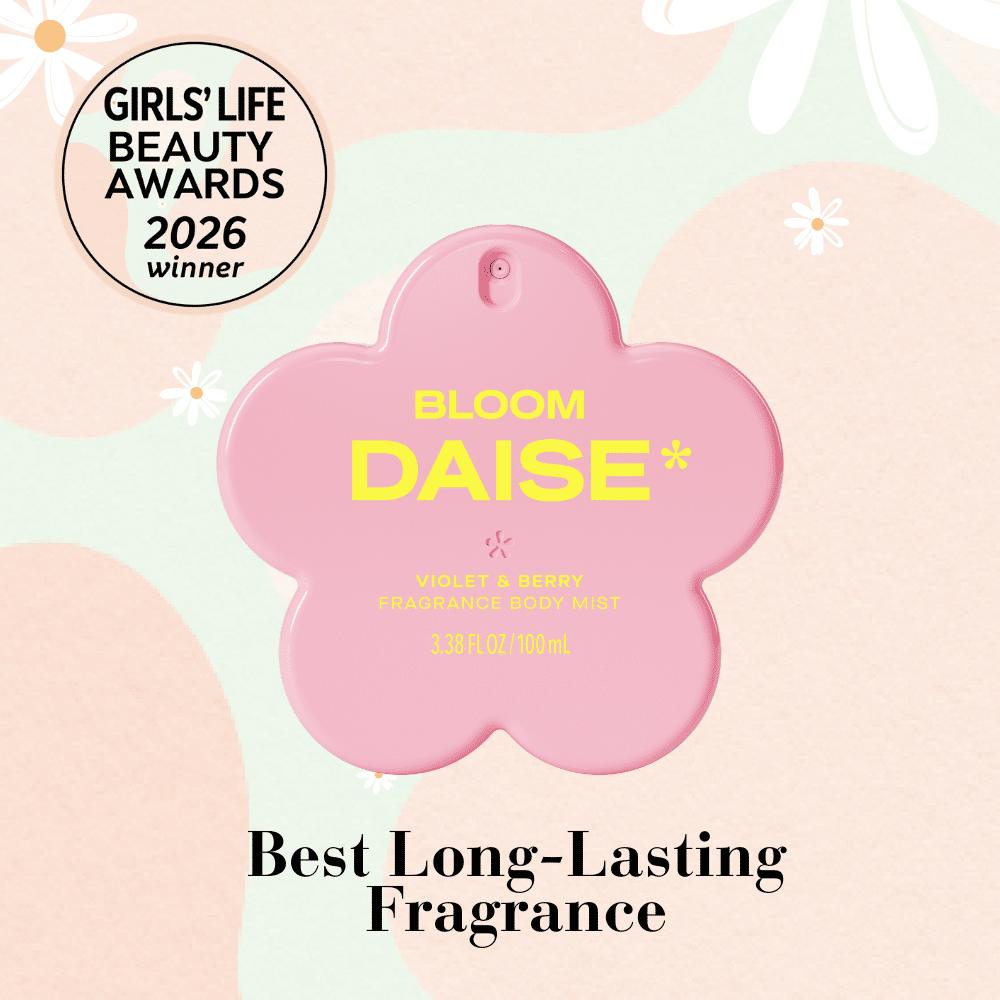 Pink flower-shaped bottle labeled BLOOM DAISE* Violet & Berry Fragrance Body Mist against a pastel floral background. Text: Best Long-Lasting Fragrance and GIRLS’ LIFE BEAUTY AWARDS 2026 winner.