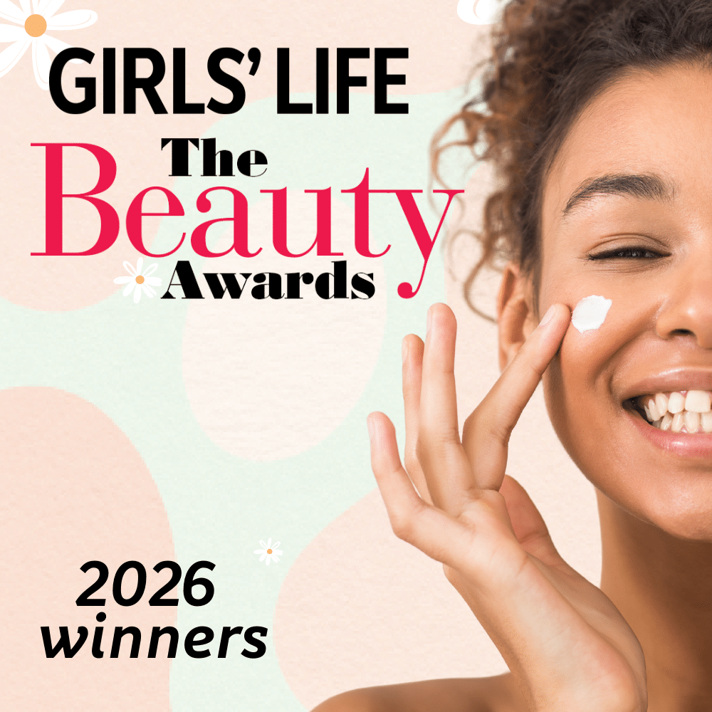 Smiling young woman applying cream to her cheek, with text: GIRLS LIFE The Beauty Awards 2026 winners on a pastel background with flower designs.