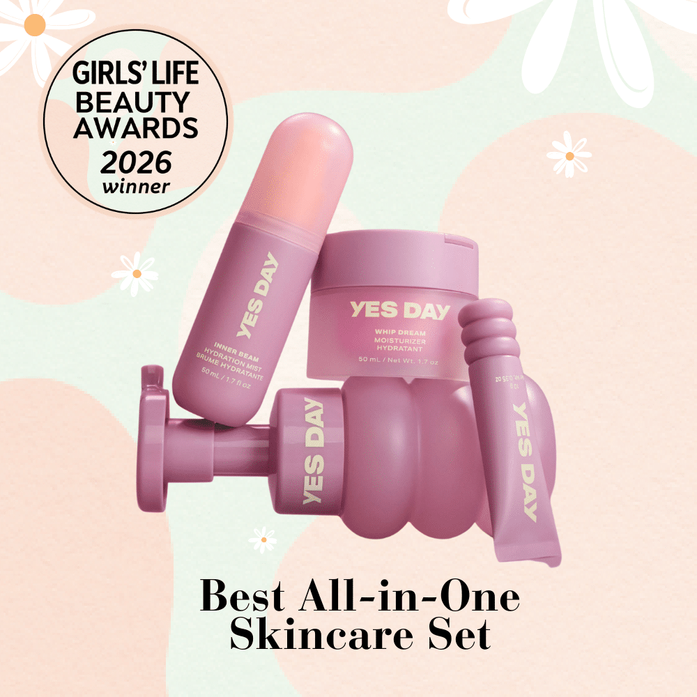 A set of four pink YES DAY skincare products is displayed on a pastel background. A badge reads Girls Life Beauty Awards 2026 winner. Text at the bottom says Best All-in-One Skincare Set.
