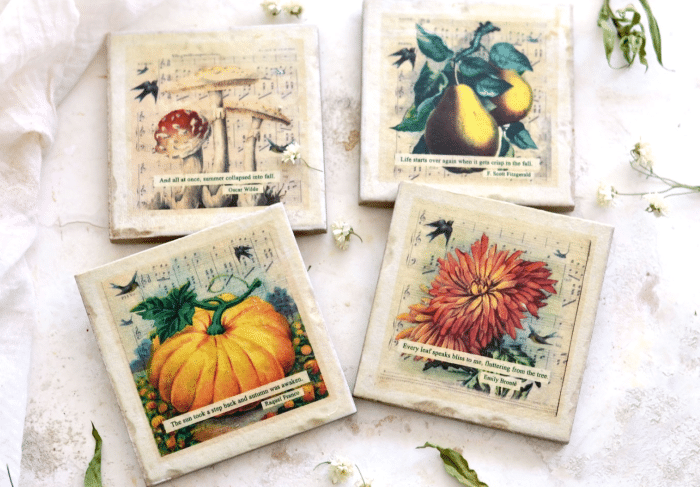 Four decorative coasters with vintage-style illustrations—a mushroom, pears, a pumpkin, and a red flower—each on a musical note background with a small quote. Scattered flowers add charming autumn flair to your home decor.