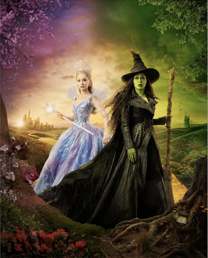 Two women stand side by side in a fantasy landscape, their looks inspired by Wicked Part 2. One glows in a sparkling blue gown and crown, while the other, with green skin, wears a dark dress and hat, holding a staff.