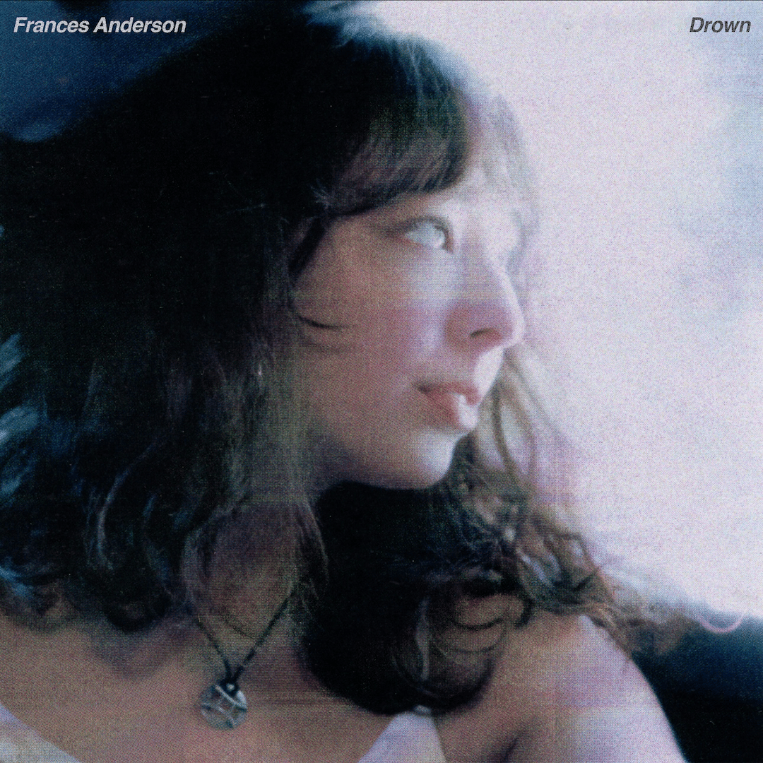 A young woman with wavy hair looks thoughtfully out of a window. Soft, ethereal light illuminates her face. The text “Frances Anderson” appears in the top left, and “Drown” in the top right, as if inviting viewers to join her fan club.